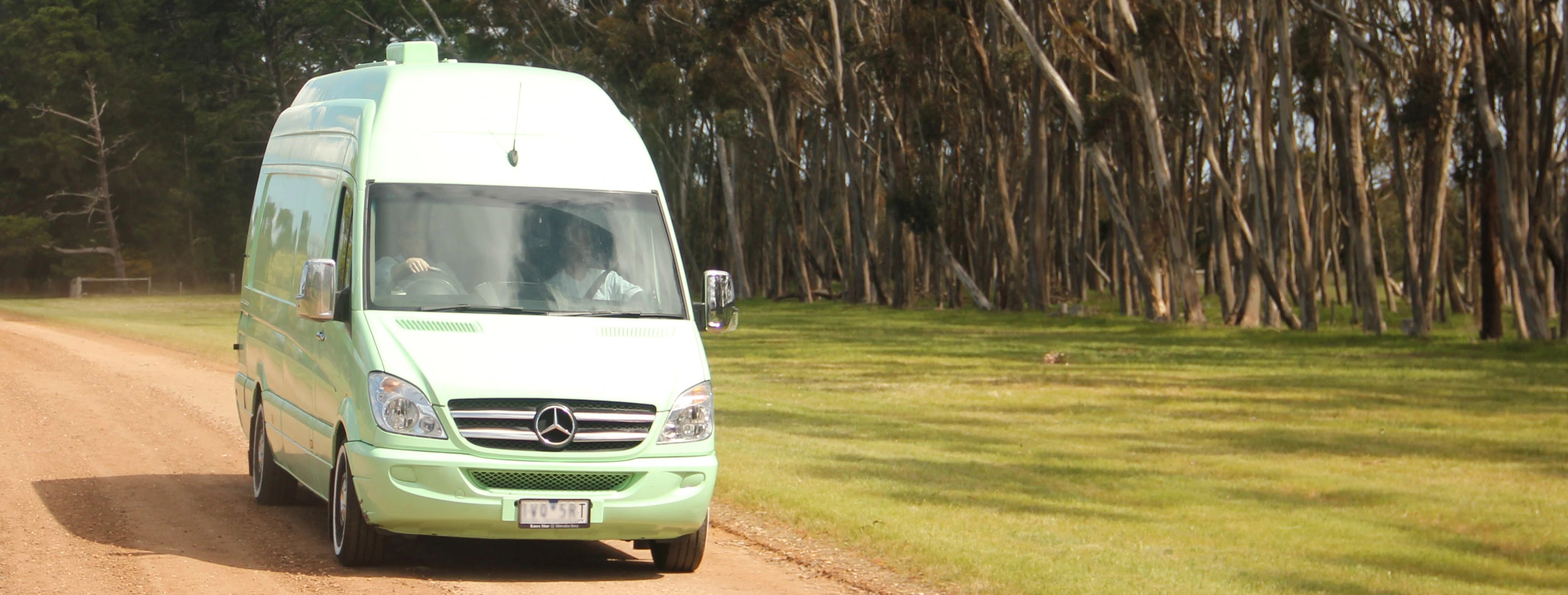 Our food truck driving down a gravel road in the countryside