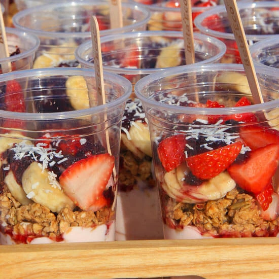 20 granola cups on a platter, ready to be served ata. wedding recovery party