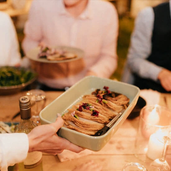 A Sharing plate of Smoked beef brisket served in the middle of the table for guests to share